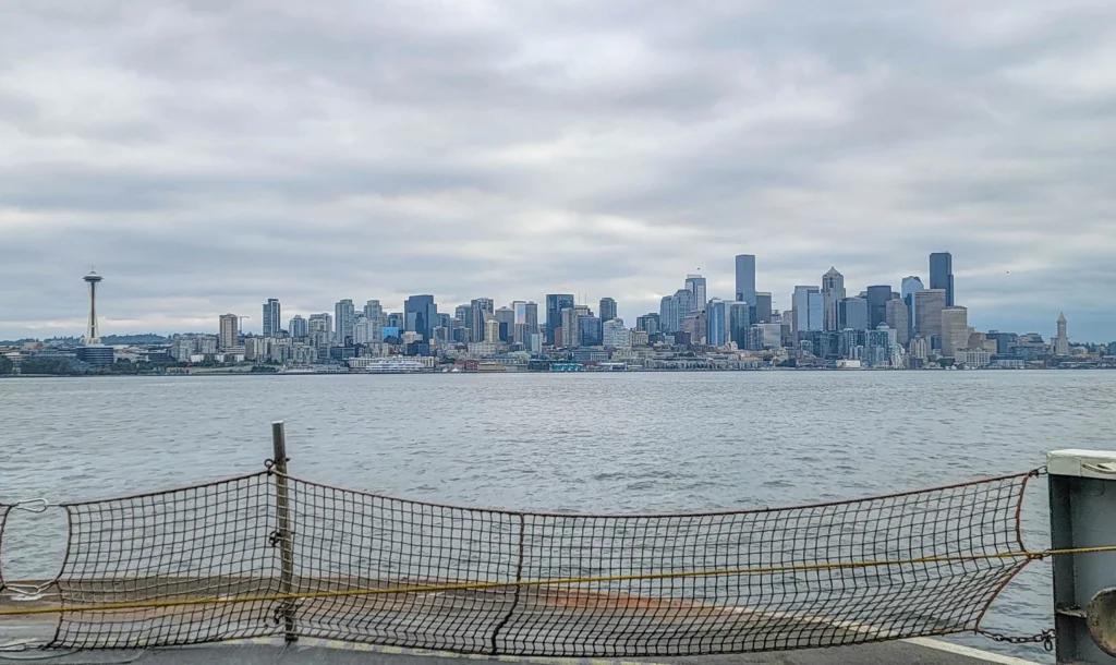 View from the front row of the Washington State Ferries Seattle ferry ride crossing Puget Sound from Bainbridge Island to Seattle under morning clouds