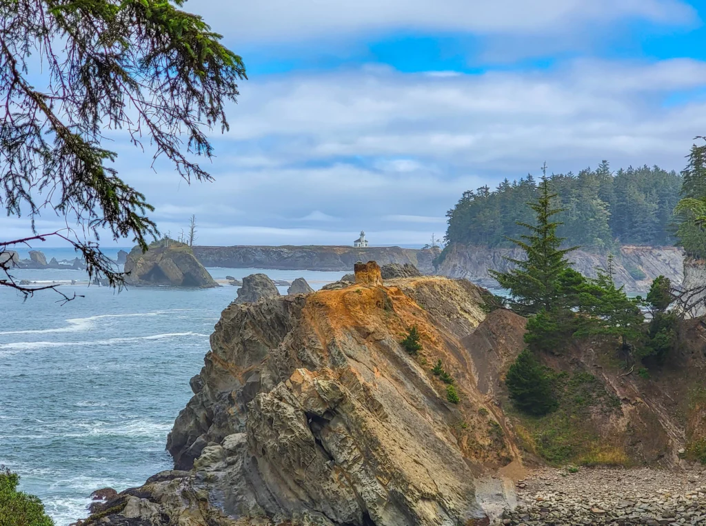 Cape Arago Lighthouse on Gregory Point seen across the water from the Lighthouse Lookout