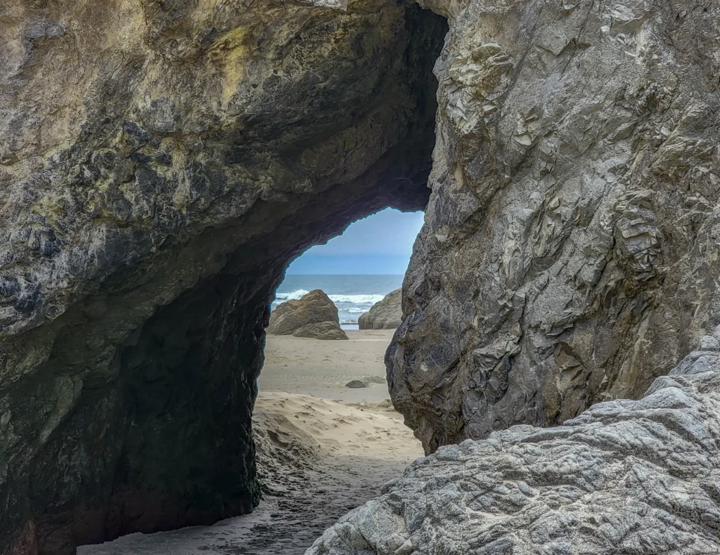 Arch worn through the base of a sea stack, Bandon Beach