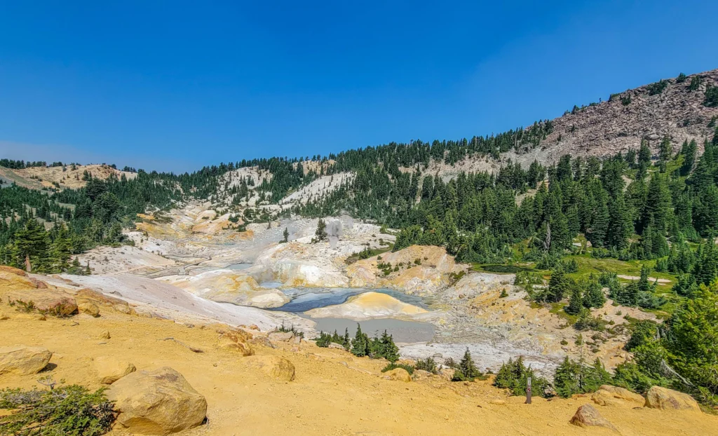 Yellow and orange sulfur-stained ground around hot pools at Bumpass Hell