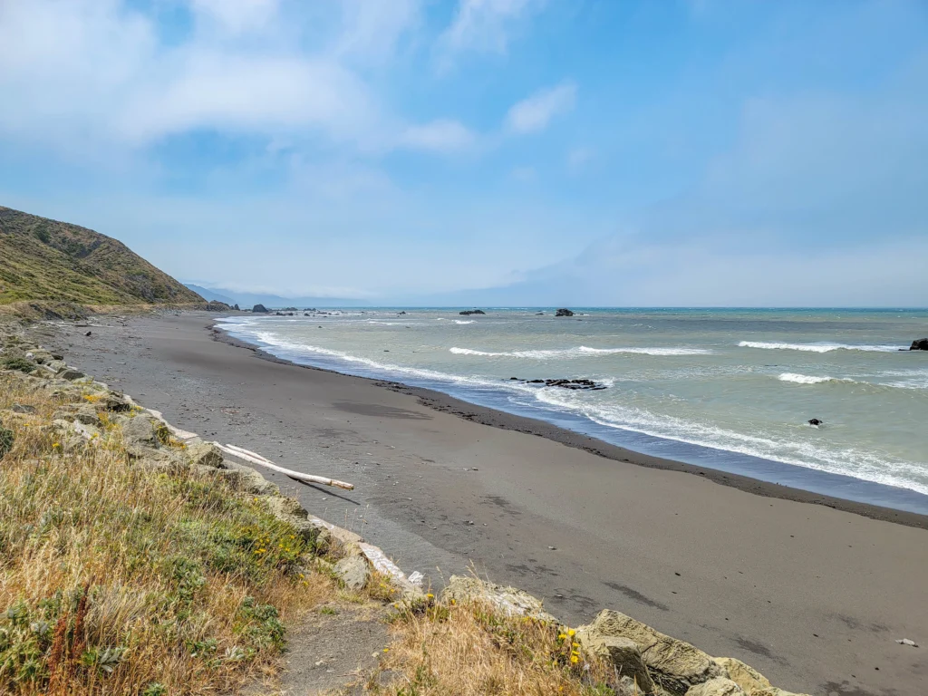 Grey sand beach and headlands along the Lost Coast