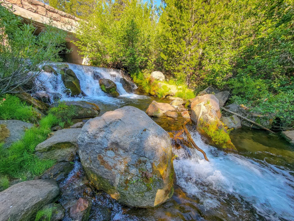 Cascade on Kings Creek running under a park highway bridge
