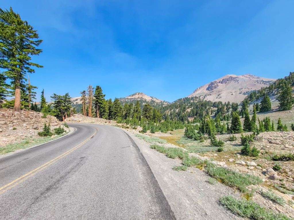 Curve on the Lassen park highway with Lassen Peak in the distance