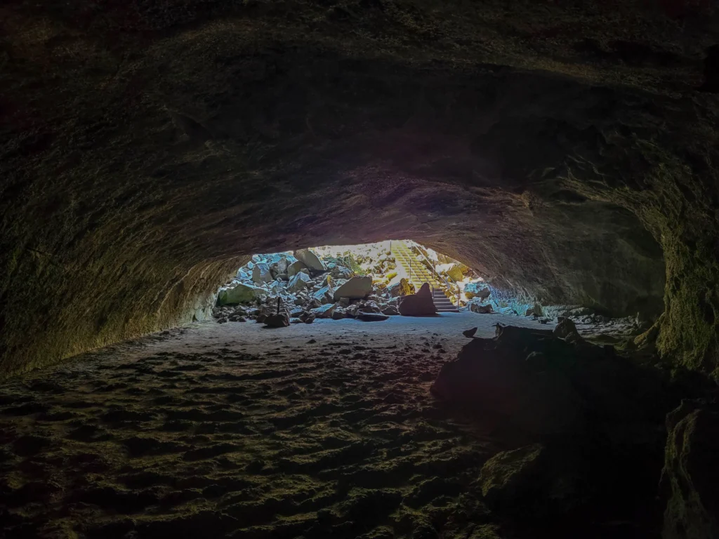 Daylight flooding into the far end of Subway Cave near the exit stairway